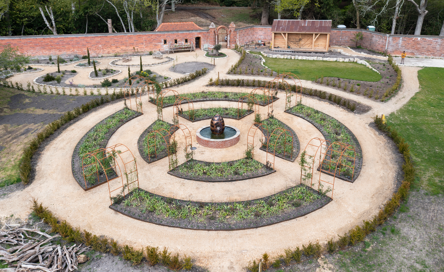 Aerial image of the rose wheel at Carey’s Secret Garden when it first opened in 2021, showcasing the new layout of the garden with its circular curved bed design.