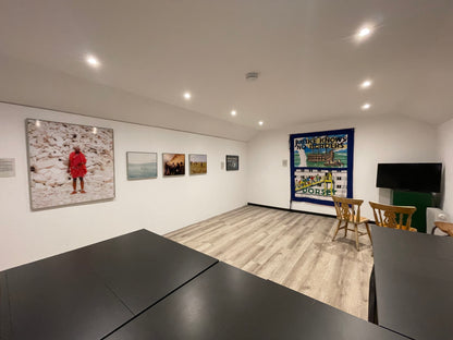 The Workroom at Carey’s transformed into the Bye Bye Bibby Gallery, showcasing powerful artwork and exhibits in a bright, creative space dedicated to meaningful storytelling